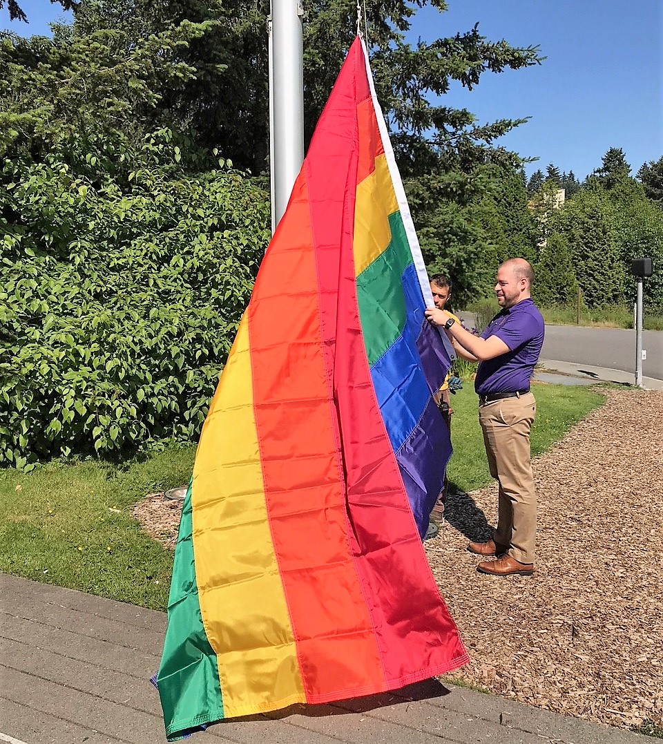 Raising the pride flag at UW Bothell