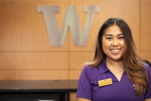 Student staff in purple polo and name tag