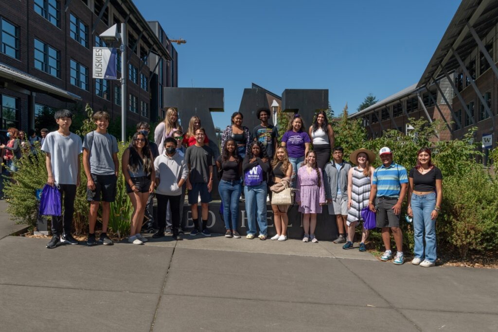 Group of student posed in front of W Bothell Statue