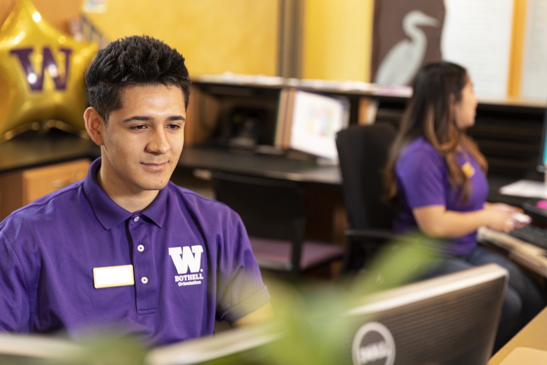 Student workers at desks.