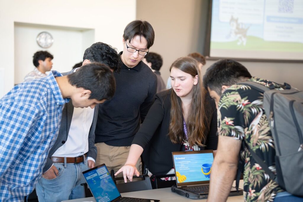 Students gathered around laptops in the ARC.
