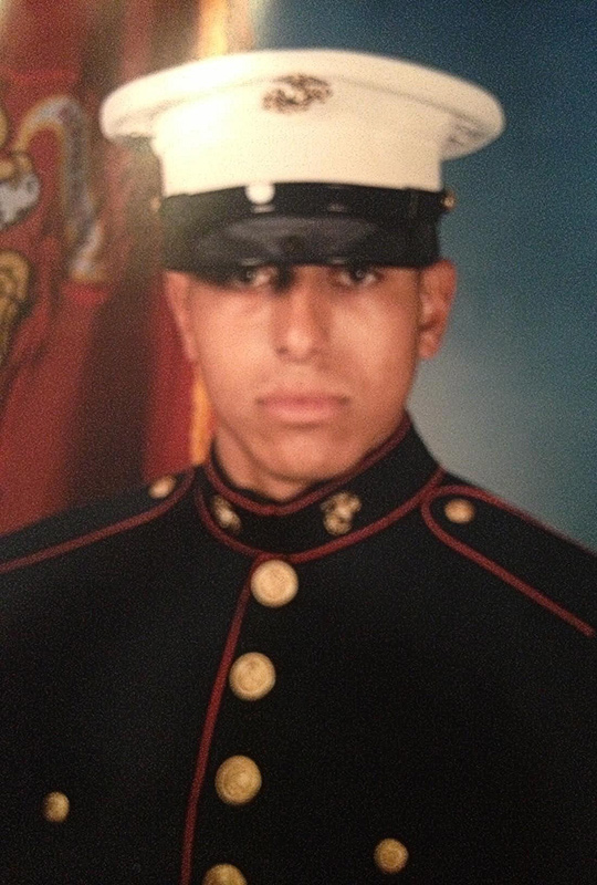 Portrait of Hector Valencia in Marine Corps uniform.