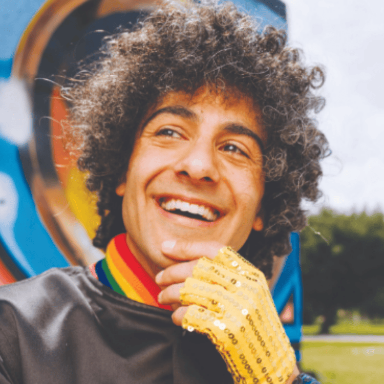 close up photo of performing artist DJ DancingFaraZ smiling