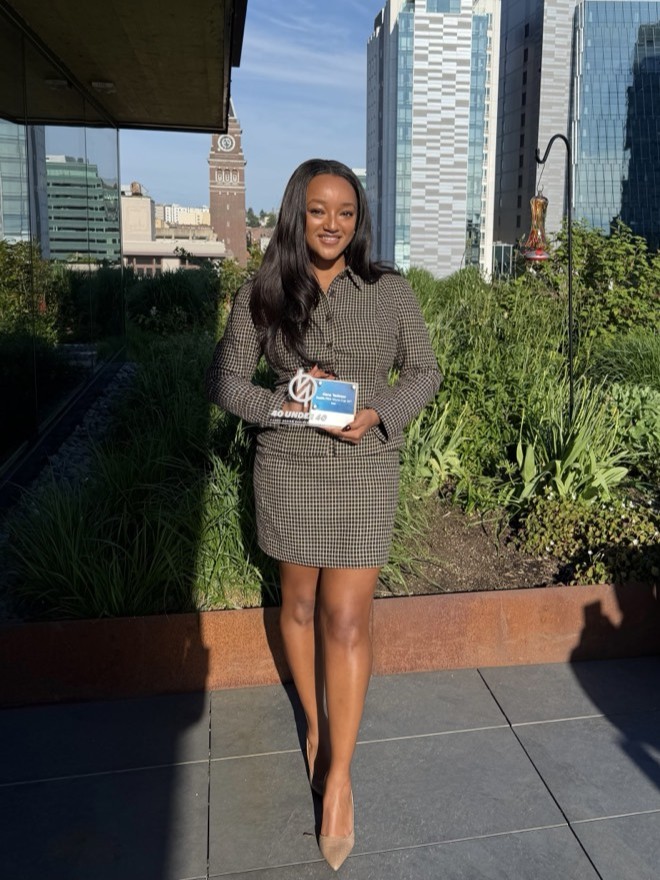 Hana Tadesse standing with her 40 Under 40 award