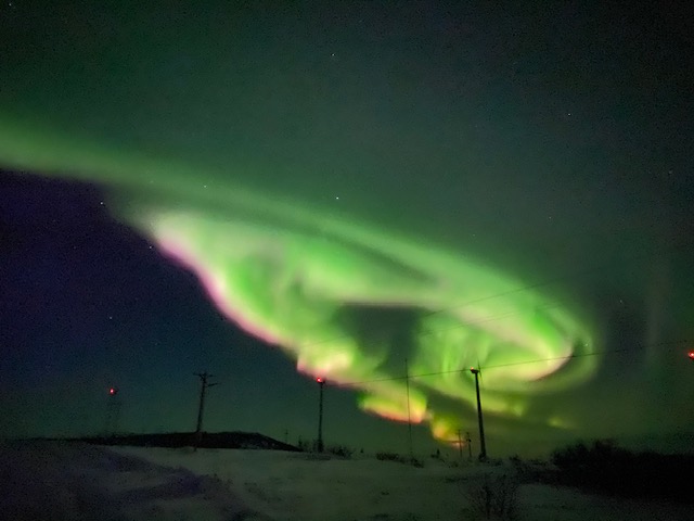 green luminescence in the dark sky (Northern Lights)