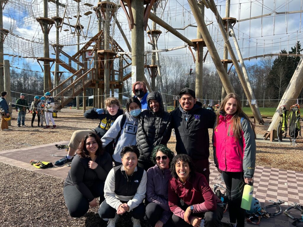 Students smiling in front of high ropes course at High Trek Adventures