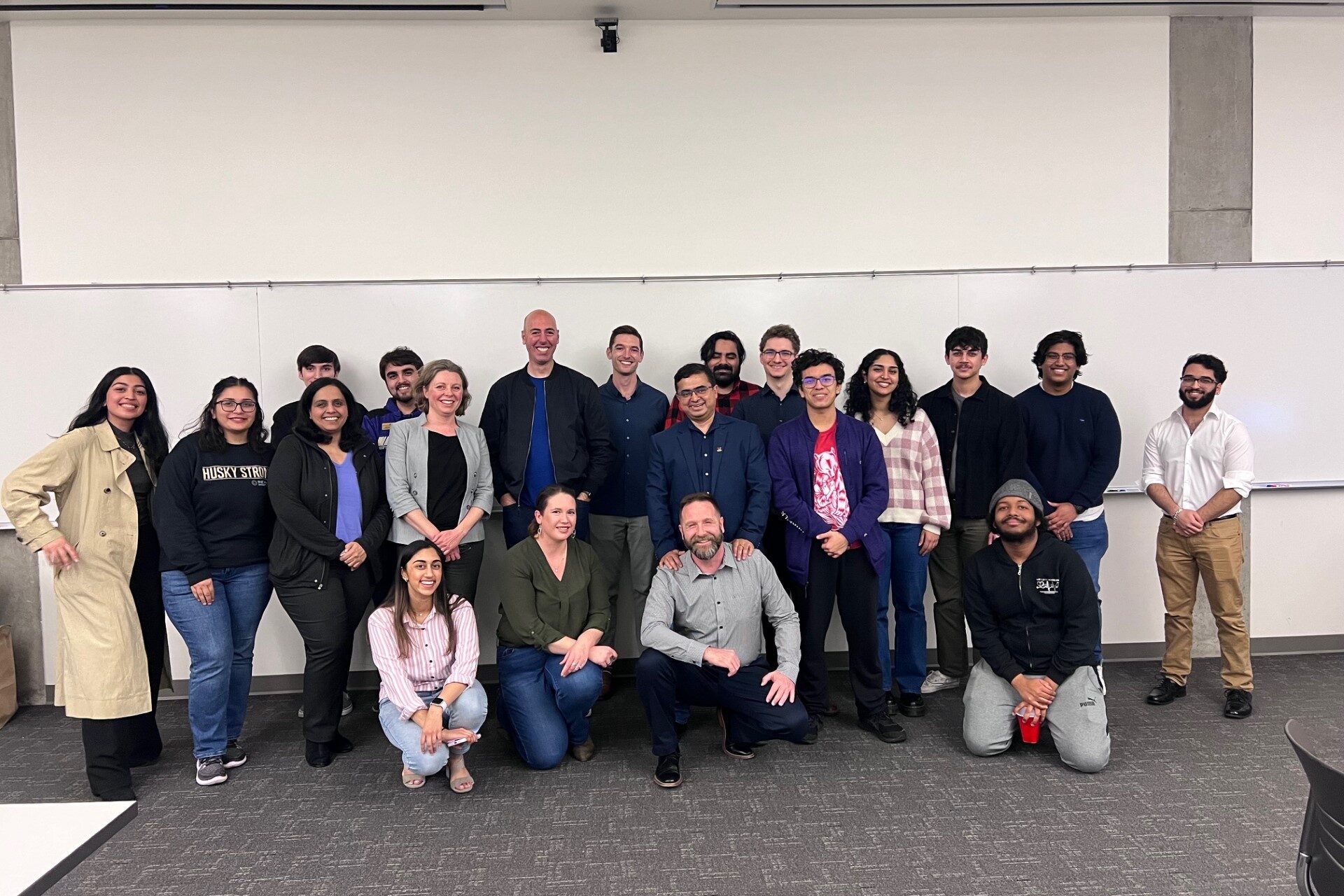 Students, staff and faculty pose with Aaron after the event
