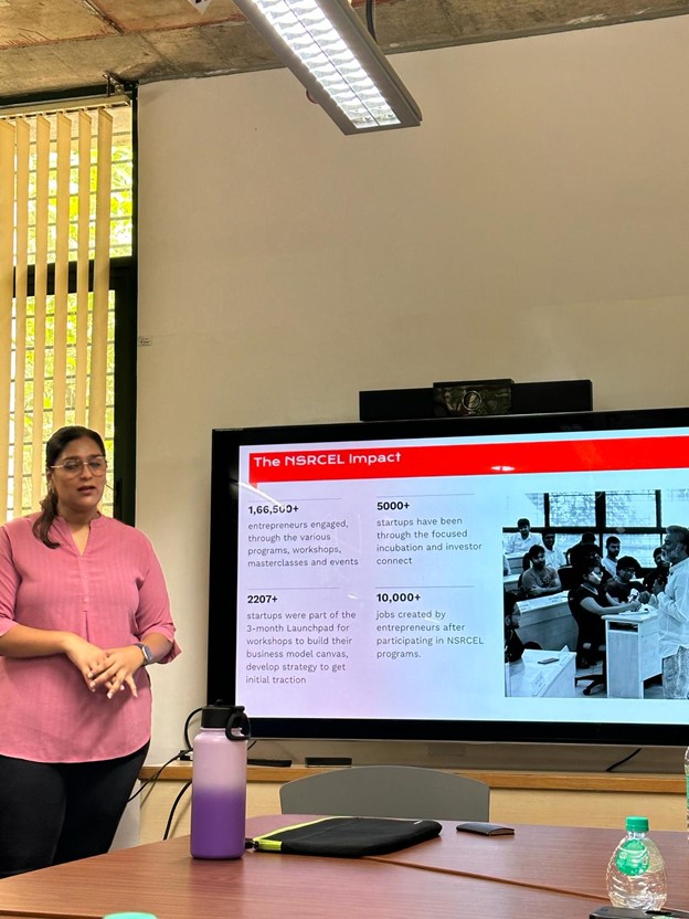 A woman giving a presentation in a conference room