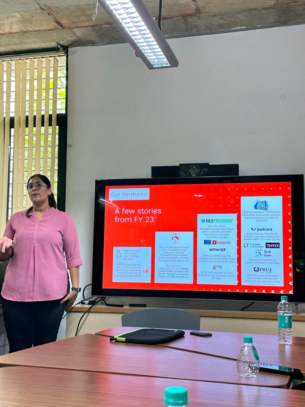 A woman giving a presentation in a conference room