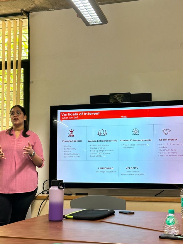 A woman giving a presentation in a conference room