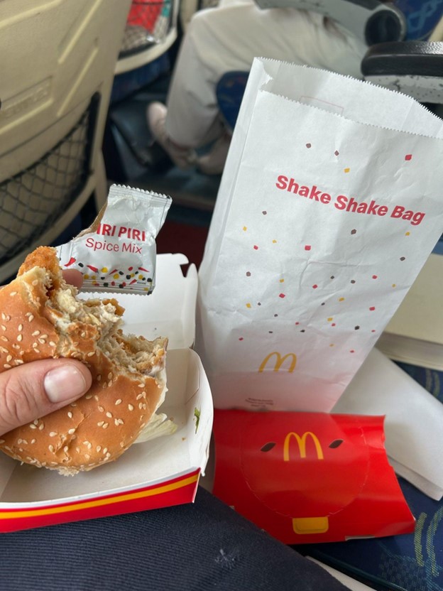 A partially-eaten McDonald's burger and product packaging