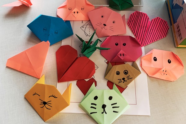 Origami hearts and animal faces folded at the event