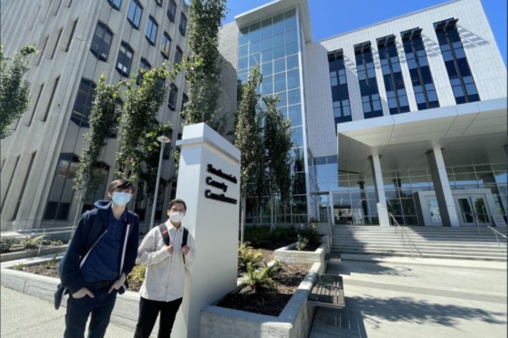 Drake Monfregola and Jordy Solorio Valdovinos in front of the Snohomish County Courthouse