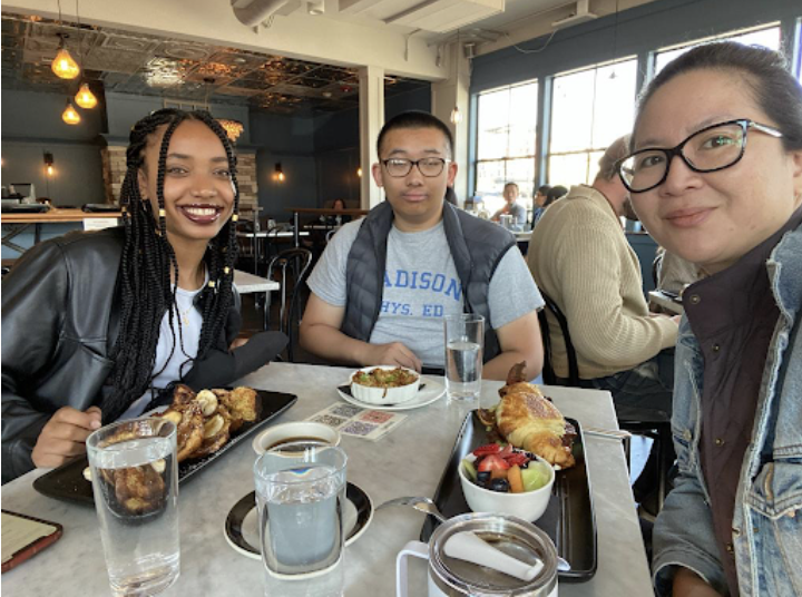 Digital Scholars, Beth Anulo and Houming Ge, with internship site supervisor, Nancy Chang, Director of Digital Navigation Services with Goodwill of the Olympics and Rainier Region. 