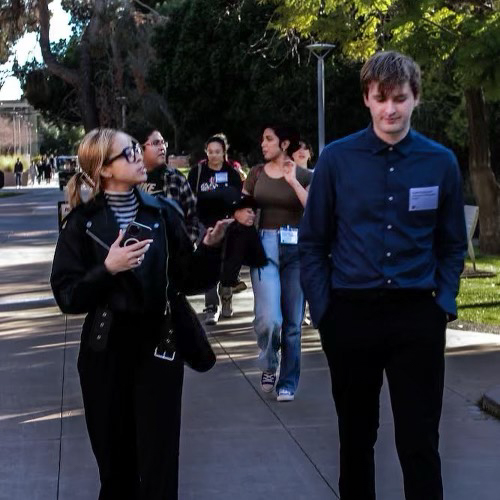 Caleb (right) talks with other ambassadors during conference