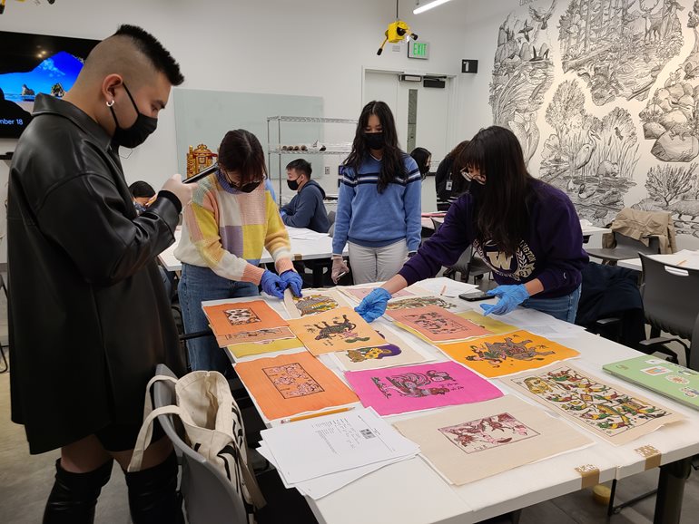 2021-2022 Cohort engaging with art collections at the Burke Museum.