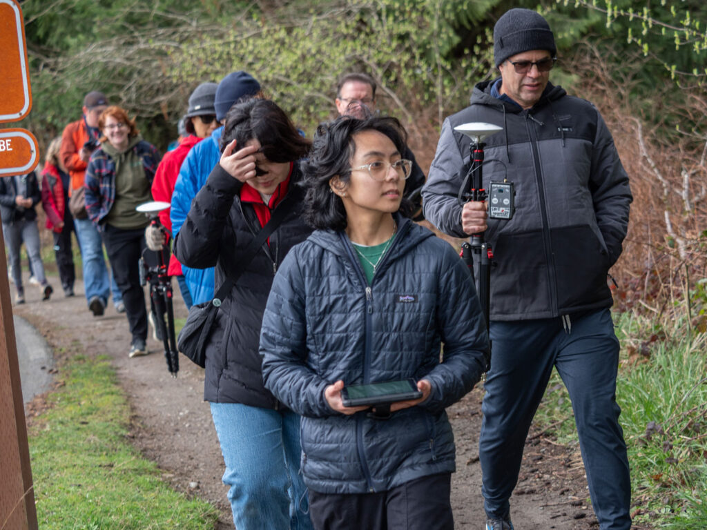 Janelle Adsuara with volunteers in the park