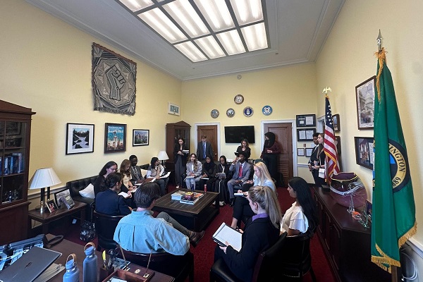 students in a small office with politicians in WA DC