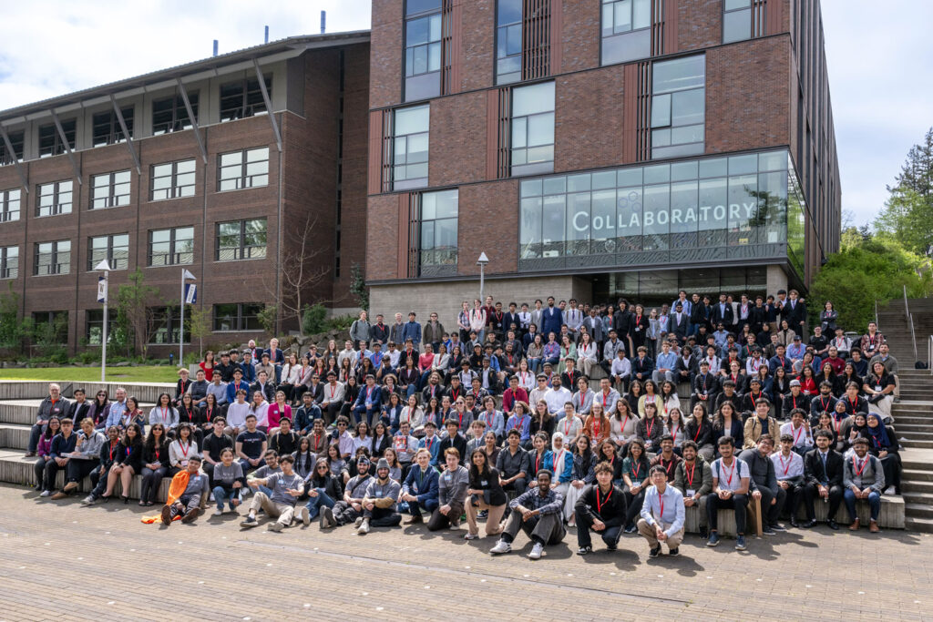 Large student group poses on campus