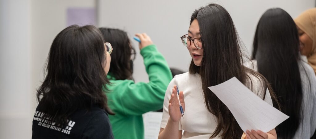 Students connect with each other during a mixer.