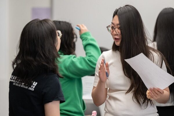 Students connect with each other during a mixer.
