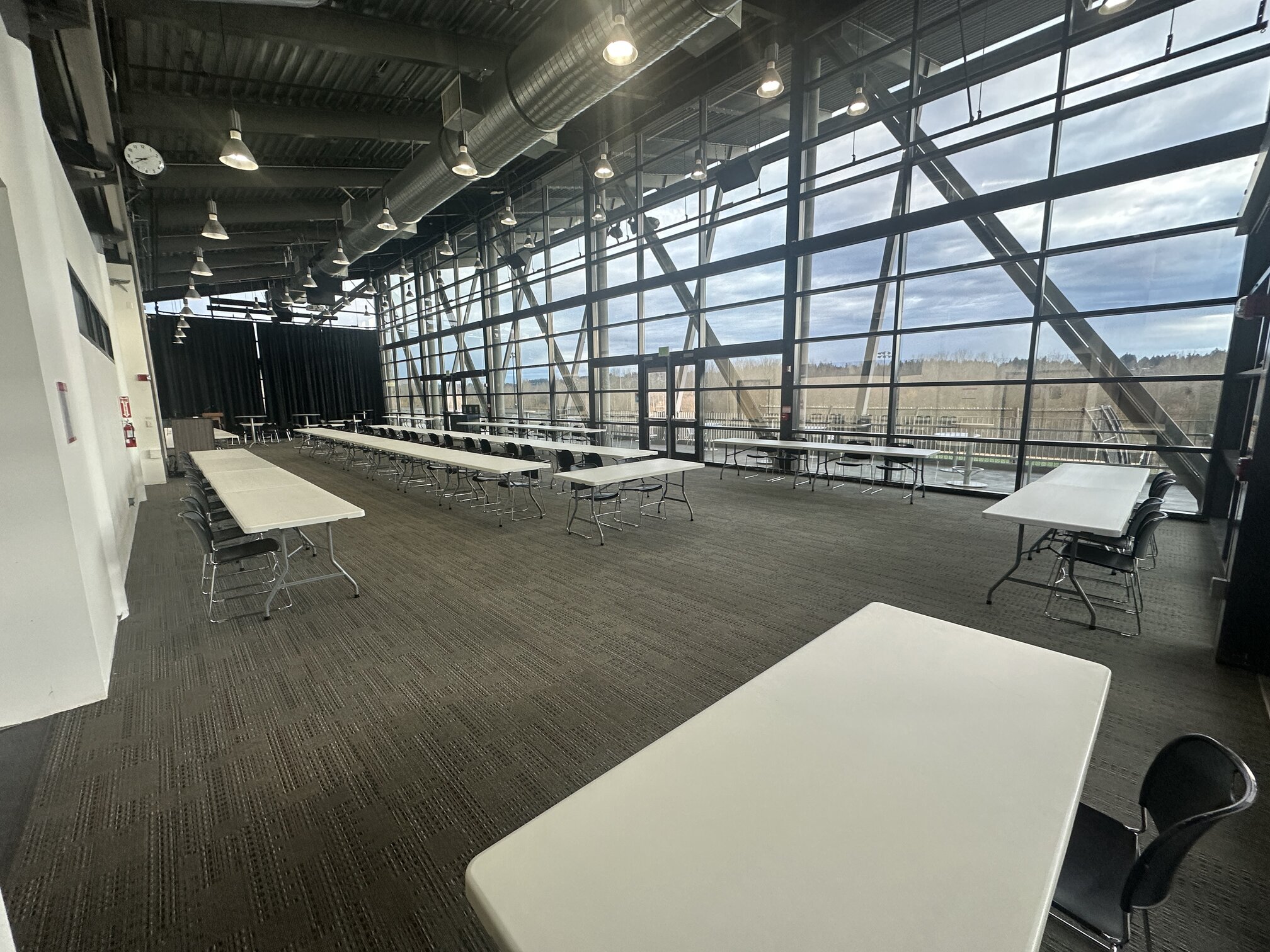 NCEC setup with a fair style layout with six-foot tables and chairs.