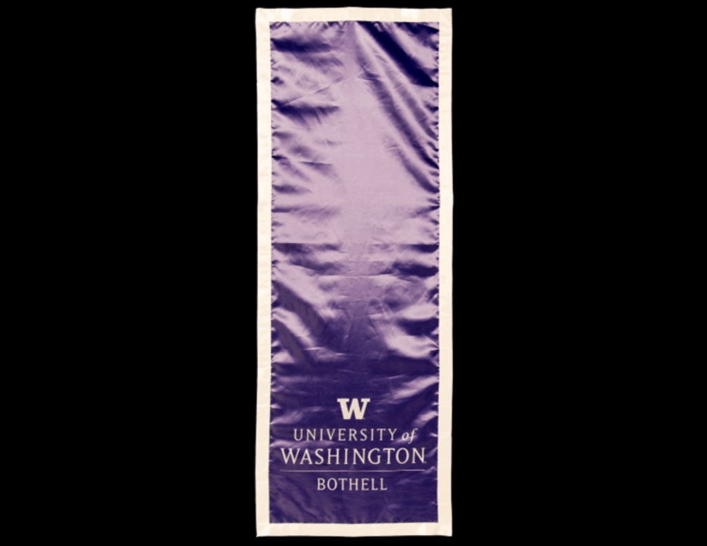 Purple table runner with University of Bothell logo on one end.