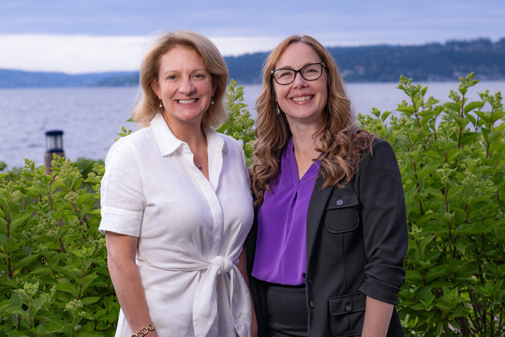 Laura Metz and Mary Hunter after the UW Bothell Recognition Reception. They are standing by the waterfront.