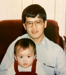 Historic photo of Patrick Miu and Carol Miu from 1983, when Carol was a baby.