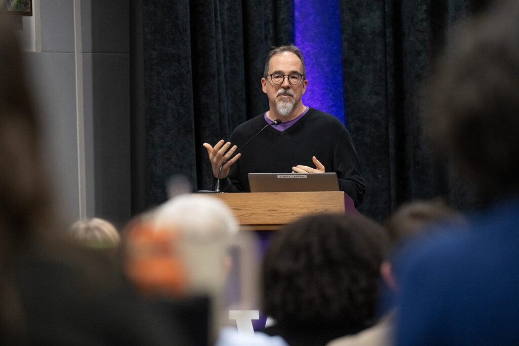 Dr. Krabill speaking to an audience from a podium.