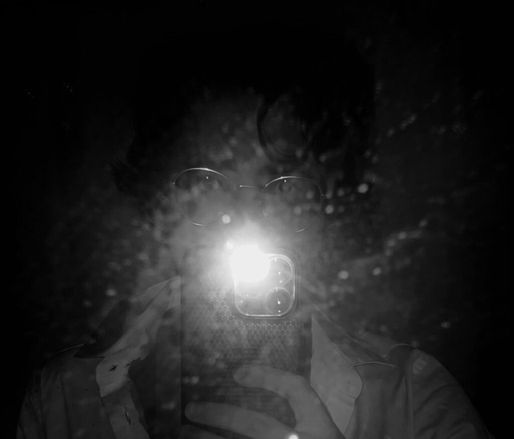 Up-close phone photo using the phone's flash. Dark and moody. 