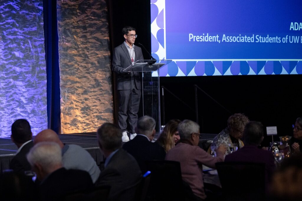 Adan Rodriguez speaking in front of a crowd