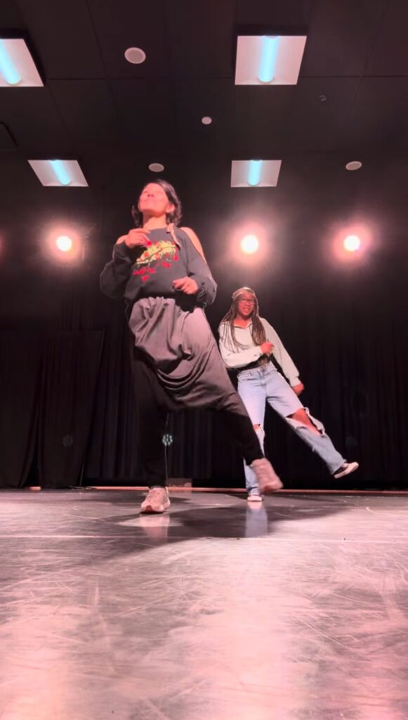 Hicks dancing with her professor