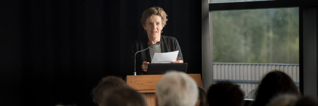 Jeanne Heuving speaking in front of an audience