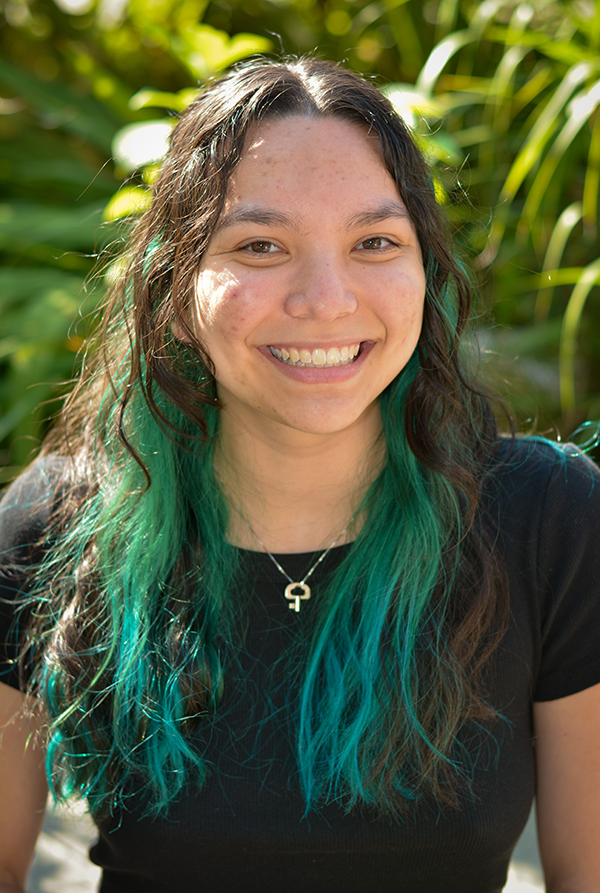 Nicolette smiles at the camera
