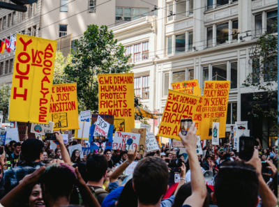 Climate protestors gathered with signs.
