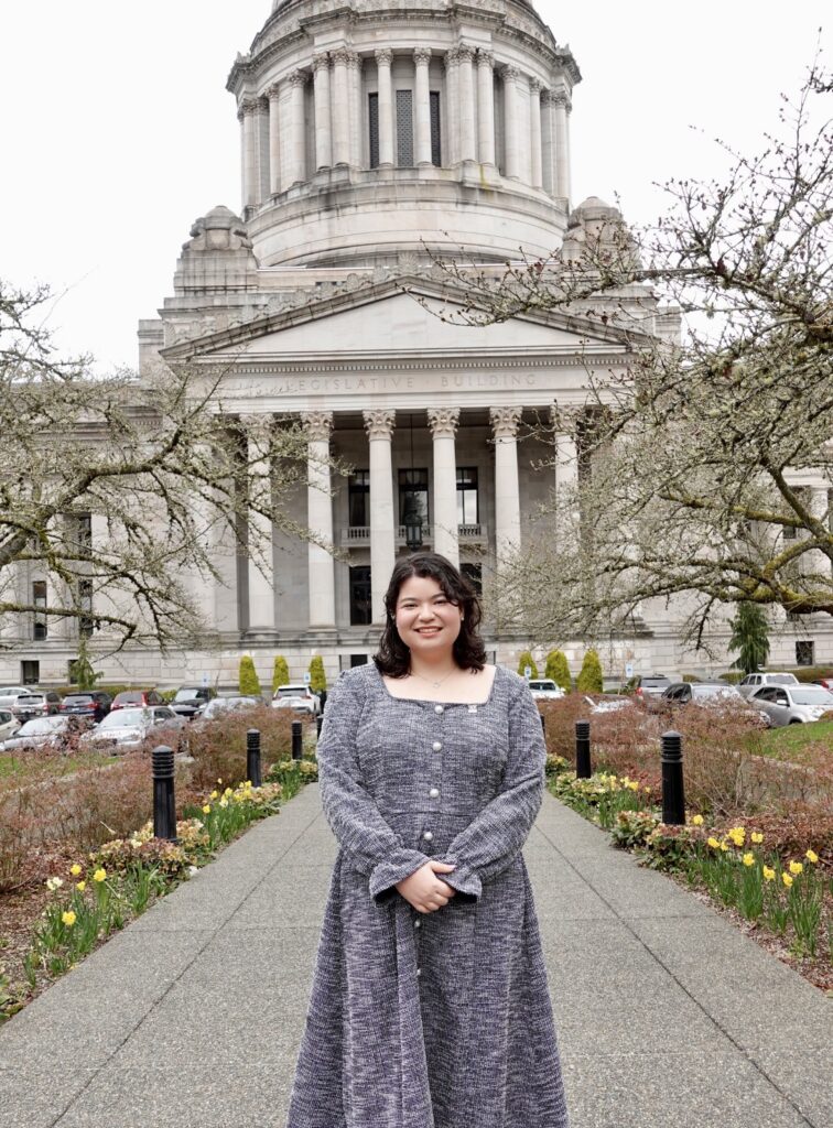 Hirano-Holcomb in front of the Washington State Capitol in Olympia