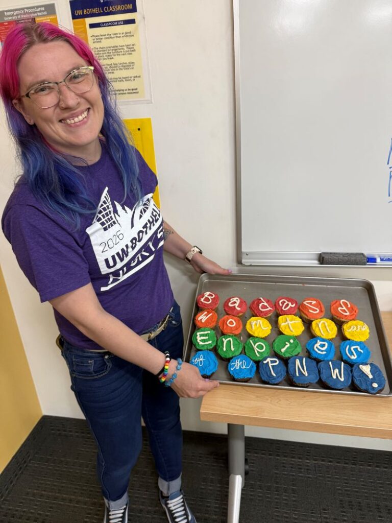 Students celebrating zine release with cupcakes.