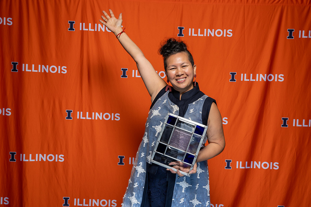 Anida Yoeu Ali holding the Distinguished Legacy Award