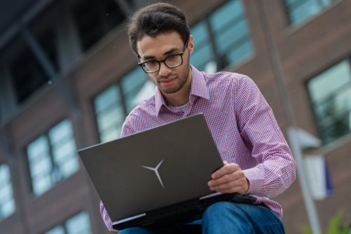 Beltagy, Computer Engineering graduate, hard at work on his laptop