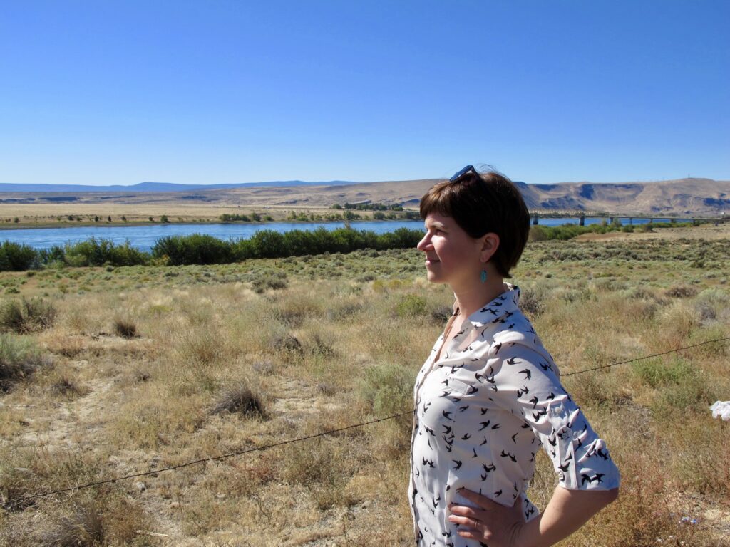 A person looking out at a flat landscape.