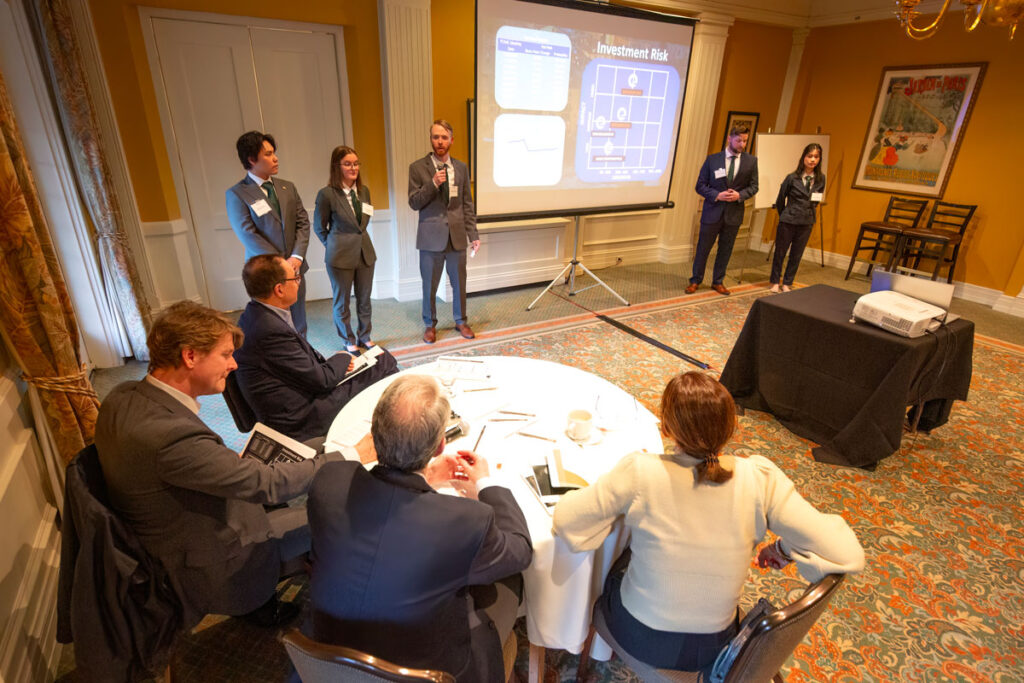 A group of people presenting.