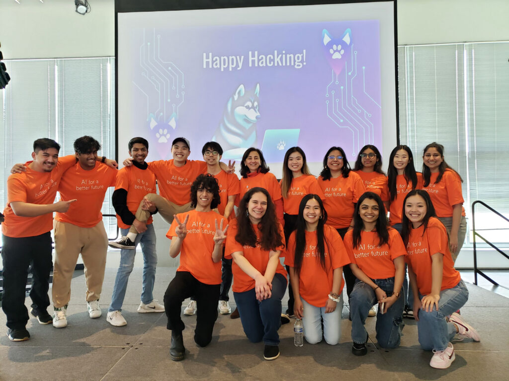 A group of people wearing orange t-shirts.