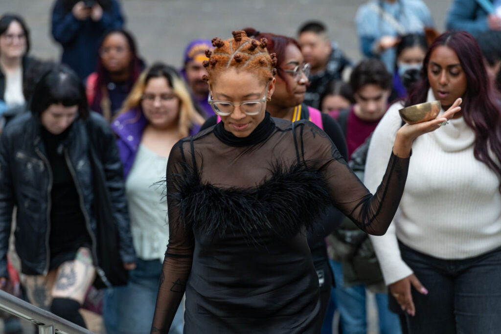 A person leading a crowd of people.