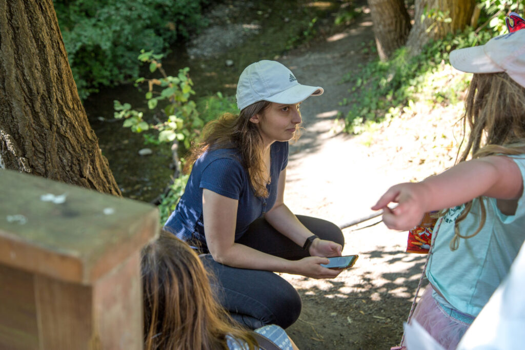 A person talking to a child.