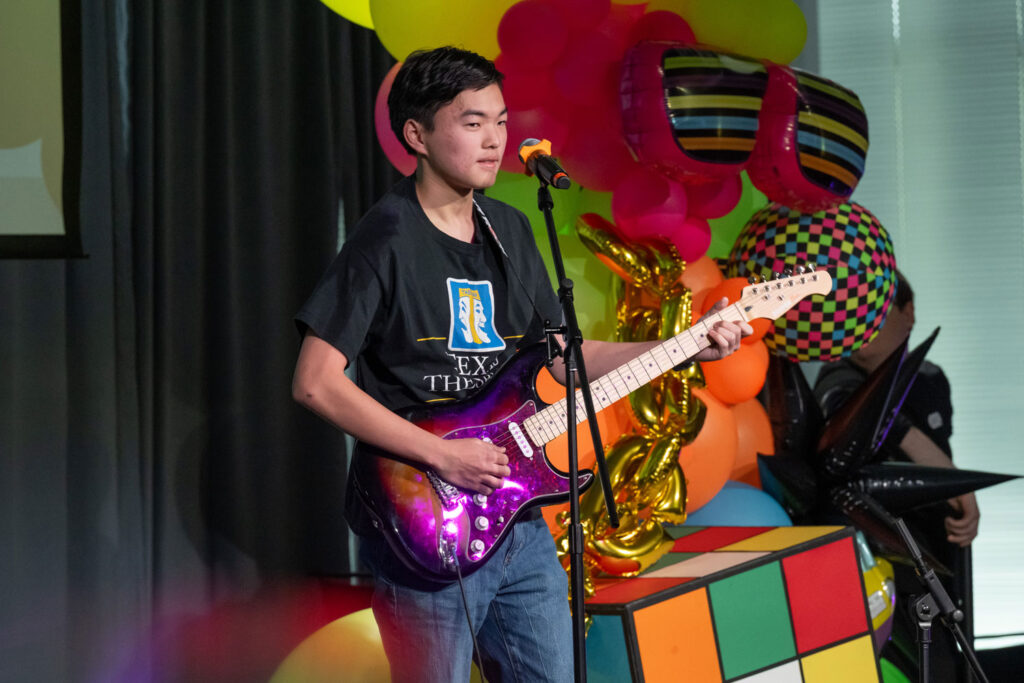 A person playing a guitar.