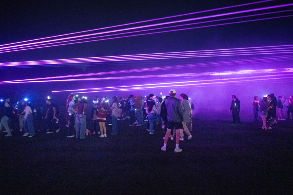 People at a laser show concert.