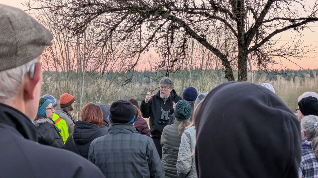 A person speaking to a crowd.