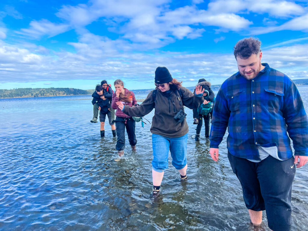 People walking through water.