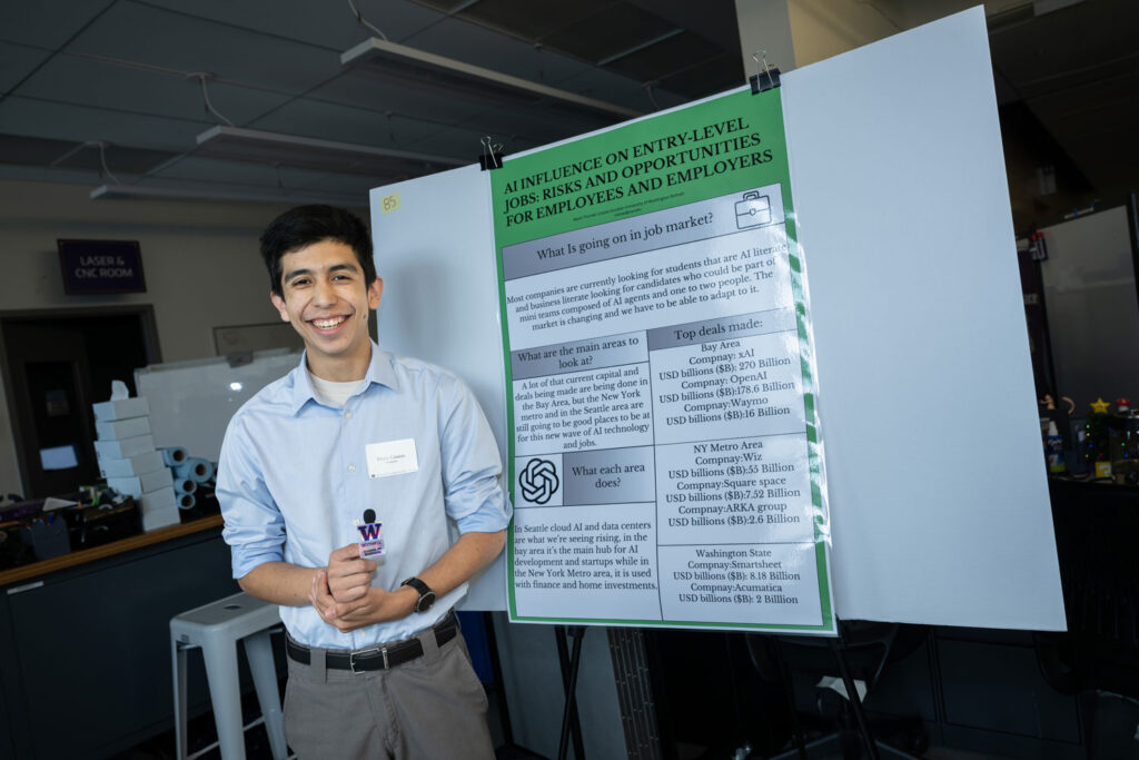 A person next to a poster.